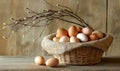 A basket of eggs is sitting on a wooden table Royalty Free Stock Photo