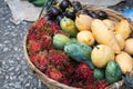 Basket with exotic fruits of mango, mangosteen and rambutan on Asian market Royalty Free Stock Photo