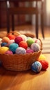 A basket filled with balls of yarn on a wooden floor Royalty Free Stock Photo