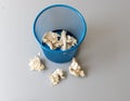Basket filled with crumpled papers and some laying outside the basket Royalty Free Stock Photo