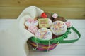 Happy mothers day words on a note in a gift basket of homemade cakes