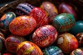 a basket filled with lots of colorfully painted easter egg\'s in it\'s natural colors and patterns on