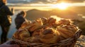 A basket of flaky buttery pastries tempts the taste buds as the group takes in the breathtaking views of the rising sun Royalty Free Stock Photo