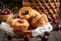 basket of flaky puff pastries, filled with sweet and tangy cherry filling