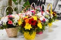 The basket of flowers. Arrangement of fresh flowers on the table. Flower shop. Flowers delivery on the house