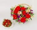 Basket with flowers and saucer with strawberries Royalty Free Stock Photo