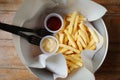 Basket of French Fries with tomato sauce Royalty Free Stock Photo