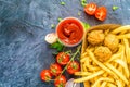 Basket of French fries with tomato sauce for dipping Royalty Free Stock Photo