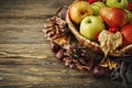 Basket with fresh apples and pears on a wooden table. Autumn background. Royalty Free Stock Photo