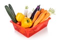 Basket of fresh assorted vegetables carrots, radish, capsicum, tomato, brinjal, cucumber