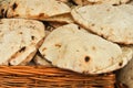 A basket with fresh baked homemade pitas at the street farm market Royalty Free Stock Photo