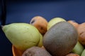 A basket of fresh fruit, kiwi and medlars. Vitamin C important for the immune system. Royalty Free Stock Photo