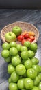 Basket and fresh fruits on table. Royalty Free Stock Photo
