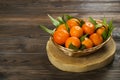 Fresh tangerine oranges on a wooden table. Peeled mandarin. Halves, slices and whole clementines closeup. Royalty Free Stock Photo