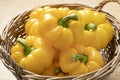 Basket with fresh picked yellow bell peppers close up Royalty Free Stock Photo