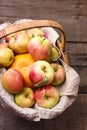 Basket of Fresh Ripe Apple and Pumpkin on Old Wooden Background Harvest Concept Autumn Fruits Vertical Top View Royalty Free Stock Photo