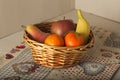 Basket of fresh seasonal fruit, mandarin, apple, pear, banana