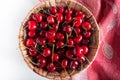 Basket of fresh sour cherries top view Cherry.. Red cherry. Fresh cherries. Cherry on white and tablecloth background . Healthy fr