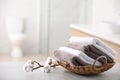 Basket with fresh towels on table Royalty Free Stock Photo