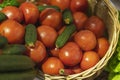 Basket with fresh vegetables, organic cucumbers tomatoes. Farmers market