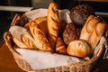 basket of freshly baked bread, including rolls, buns, and baguettes Royalty Free Stock Photo