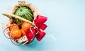 Basket with fruit on blue background. watermelon and oranges on blue pastel background Royalty Free Stock Photo