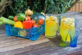 Basket of fruit with jug of orange squash.