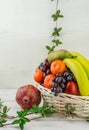 Basket of fruit on white background banana melon apples orange grapes Royalty Free Stock Photo