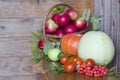 Basket with fruits on a wooden background. harvesting autumn and summer harvest. vegetables and fruits pumpkin, zucchini, apple, Royalty Free Stock Photo