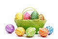 Basket full of Easter eggs isolated on white background Royalty Free Stock Photo