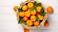 Basket full of fresh whole juicy clementine oranges with leaves on white wooden textured table. Generative AI Royalty Free Stock Photo