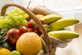 Basket full of fruits on a light background - high key Royalty Free Stock Photo