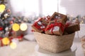 Basket full of gift boxes for Christmas advent calendar in room, space for text