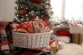 Basket full of gifts in paper bags for Christmas advent calendar at home, space for text