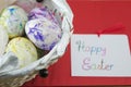 Basket full of handcolored Easter Eggs in decoupage Royalty Free Stock Photo