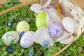 Basket full of handcolored Easter Eggs in decoupage Royalty Free Stock Photo