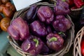 A basket full of purple capsicums