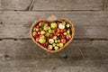 Basket full of ripe apples and pears on a wooden background. View from above. Flat lay. Copy space. Harvest concept Royalty Free Stock Photo