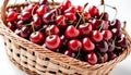 A basket full of sweet red cherries isolated on white background Royalty Free Stock Photo