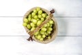 Basket with grapes on a white wooden background Royalty Free Stock Photo