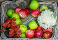Basket with green, red apples and zucchini Royalty Free Stock Photo