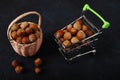 Basket Hazelnuts, filbert in burlap sack on wooden backdrop. heap or stack of hazelnuts Royalty Free Stock Photo