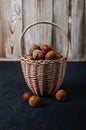 Basket Hazelnuts, filbert on wooden backdrop. heap or stack of hazelnuts. Hazelnut background Royalty Free Stock Photo