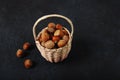 Basket Hazelnuts, filbert on wooden backdrop. heap or stack of hazelnuts. Hazelnut background