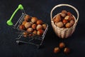 Basket Hazelnuts, filbert on wooden backdrop. heap or stack of hazelnuts Royalty Free Stock Photo