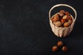 Basket Hazelnuts, filbert on wooden backdrop. heap or stack of hazelnuts. Hazelnut background Royalty Free Stock Photo