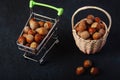 Basket Hazelnuts, filbert on wooden backdrop. heap or stack of hazelnuts