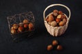 Basket Hazelnuts, filbert on wooden backdrop. heap or stack of hazelnuts