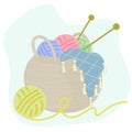 Basket with knitting, multi-colored wool balls of yarn and knitting needles and a plaid. Vector illustration in flat Royalty Free Stock Photo