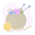 Basket with knitting, multi-colored wool balls of yarn and knitting needles. Vector illustration in cartoon flat style Royalty Free Stock Photo